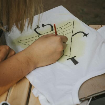 Woman Making a Drawing on a T-Shirt